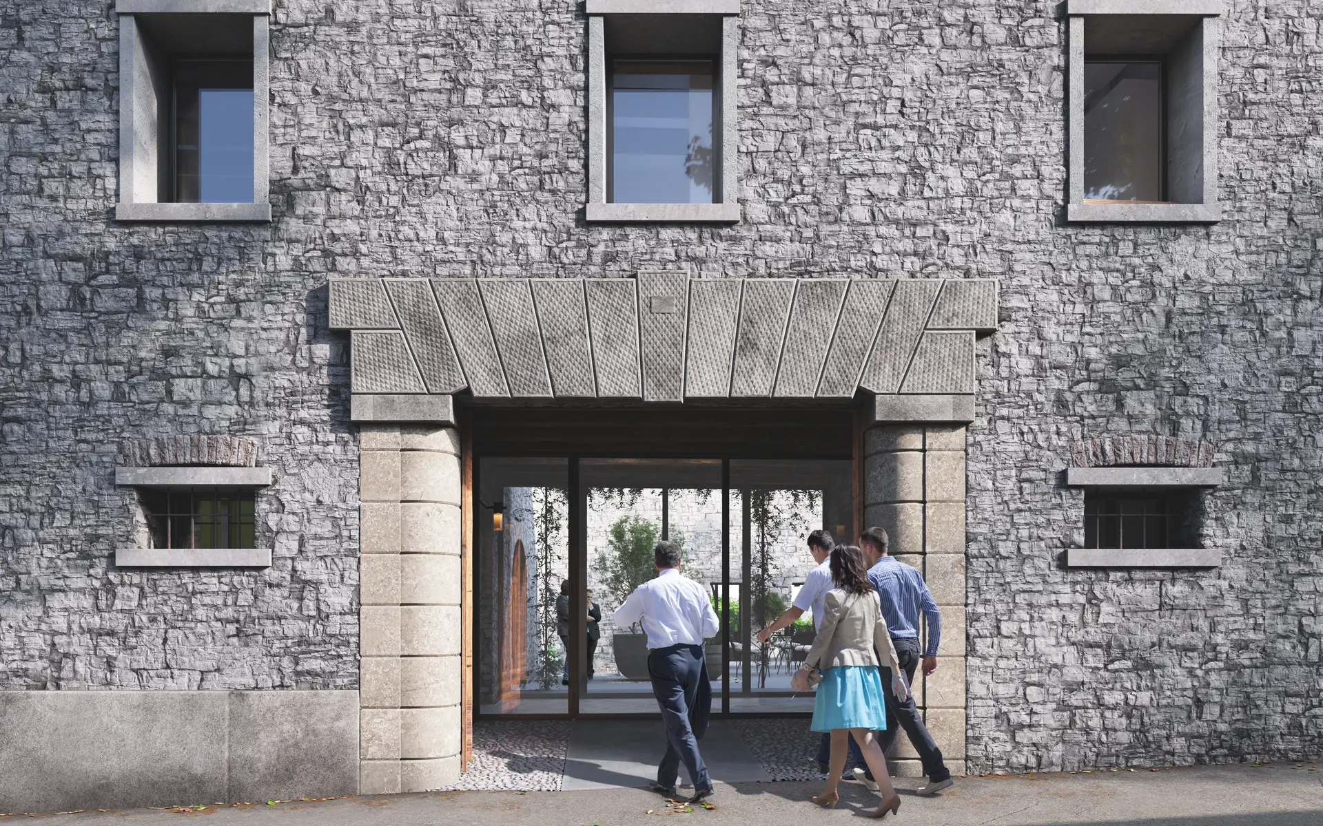 Ingresso in pietra del Relais Borgo Taurino con architrave a raggiera e accesso al cortile interno
